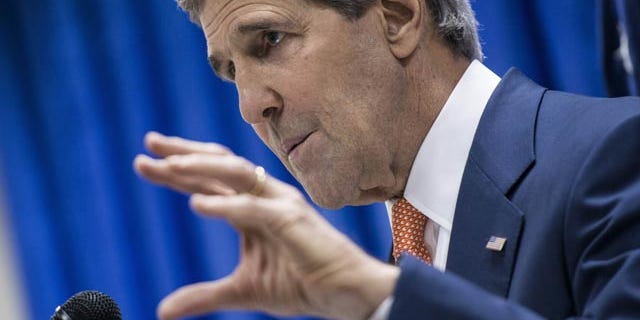 June 23, 2014: U.S. Secretary of State John Kerry speaks during a press conference at the U.S. Embassy in Baghdad, Iraq. (AP Photo/Brendan Smialowski, Pool)