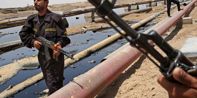 Iraqi Forces guarding oil fields.