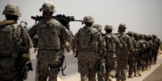 Aug. 2, 2011: U.S. Army soldiers make their way to a C-130 aircraft at Sather Air Base in Baghdad, Iraq to begin their journey home to the United States.