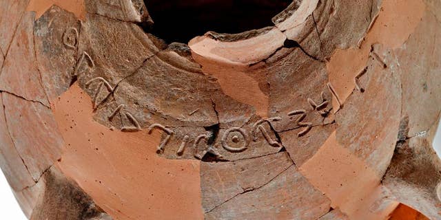 This undated photo released by the Israel Antiquities Authority, shows a 3.000 year old ceramic jar with inscription of a name mentioned in the Bible,“Eshbaal Ben Beda.” Israel’s antiquities authority says archaeologists have discovered a rare 3,000-year-old inscription of a name mentioned in the Bible. Eshbaal of the Bible was a son of King Saul. Archaeologists said Tuesday, June 16, 2015 it is the first time the name was discovered in an ancient inscription. It is one of only four inscriptions discovered from the biblical 10th century B.C. Kingdom of Judah, when King David is said to have reigned. (Tal Rogovski/Israel Antiquities Authority via AP)