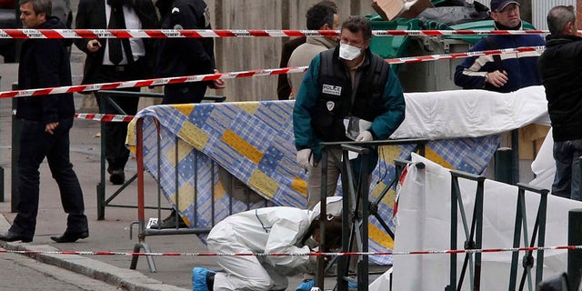 March 19, 2012: In this file photo, police officers gather at the site of a shooting where a gunman opened fire in front of a Jewish school in a city in Toulouse, southwestern France. Israeli researchers and Jewish leaders on Sunday reported 30 percent jump in anti-Semitic violence and vandalism last year.