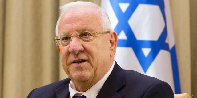 FILE - In this Nov. 3, 2014 file photo, Israel's President Reuven Rivlin, attends a meeting at the President's residence in Jerusalem. A canceled bar mitzvah ceremony for boys with disabilities is highlighting a rift between Israel's Orthodox majority and its more marginal streams of Judaism. President Reuven Rivlin had agreed to hold the ceremony at his residence but later suggested a non-religious event. (AP Photo/Sebastian Scheiner, File)