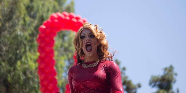 A drag queen sings during the annual Gay Pride Parade in Tel Aviv, Israel, Friday, June 12, 2015. 