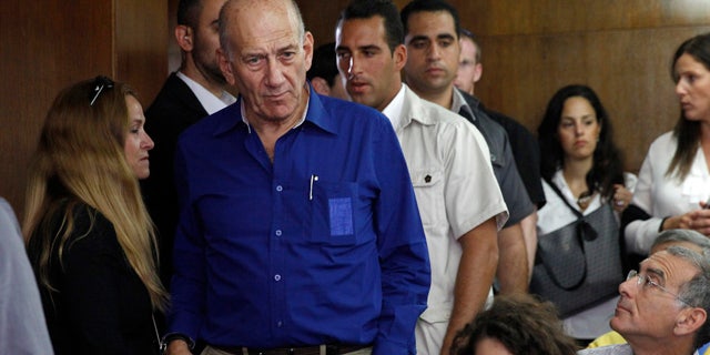 FILE - This May 13, 2014, file photo shows Israel's former Prime Minister Ehud Olmert at the Tel Aviv District Court in Israel. (AP Photo/Finbarr O'Reilly, File)