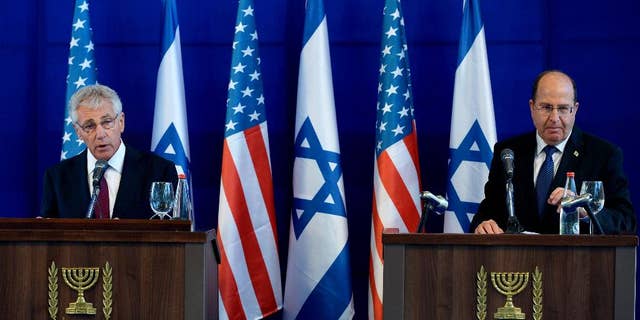 U.S. Defense Secretary Chuck Hagel, left, and Israel's Defense Minister Moshe Yaalon, right, speak during a joint conference following a meeting at Israel's Defense Force headquarters in Tel Aviv, Thursday, May 15, 2014. Hagel is on a regional tour focusing on Iran's nuclear program and Syria's civil war. (AP Photo/Mandel Ngan, Pool)