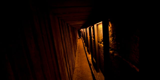 A visitor walks through the Western Wall tunnel in Jerusalem's Old City. Underneath the stone buildings and crowded alleys of old Jerusalem, hundreds of people are moving at any given moment through tunnels, vaulted medieval chambers and Roman sewers in a rapidly expanding subterranean city invisible from the streets above.