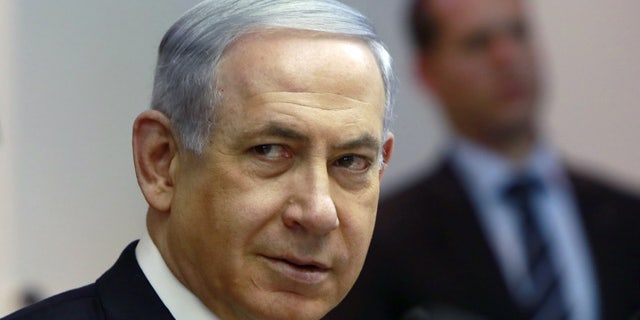 March 8, 2015: Israeli Prime Minister Benjamin Netanyahu chairs the weekly cabinet meeting at his Jerusalem office, Sunday. (AP Photo/Gali Tibbon, Pool)