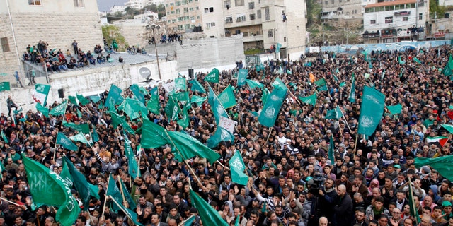 Dec. 14, 2012 - Palestinian supporters of Hamas gather during a rally to celebrate the 25th anniversary of the militant group, in the West Bank city of Hebron.