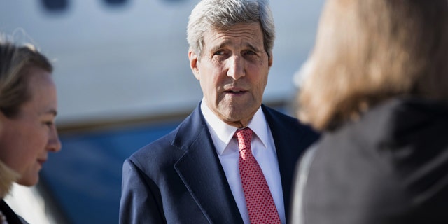 September 10, 2014: U.S. Secretary of State John Kerry arrives at Queen Alia Airport in Amman, Jordan. (AP Photo/Brendan Smialowski, Pool)
