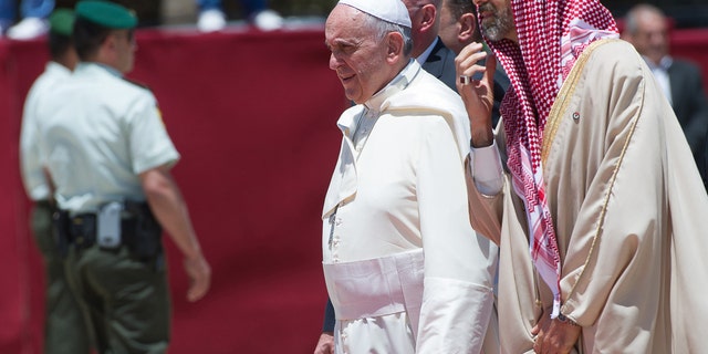 May 24, 2014: In this photo provided by the Vatican newspaper L'Osservatore Romano, Pope Francis is welcomed upon his arrival in Amman, Jordan.