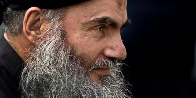 FILE - November 12, 2013: Radical Al Qaeda-linked preacher Abu Qatada arrives back to his residence in London after being freed from prison. A Jordanian military court has acquitted Abu Qatada of terror charges over a foiled 1999 plot to attack an American school in the Jordanian capital, Amman. (AP Photo/Matt Dunham, File)