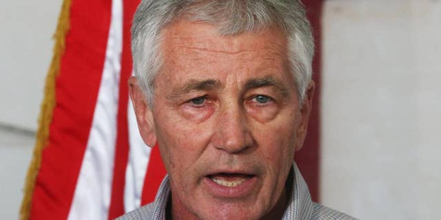 U.S. Secretary of Defense Chuck Hagel speaks during a press conference after visiting U.S. troops in Kuwait City, Monday, Dec. 8, 2014. Hagel visited the camp which once was a staging post for troops headed to Iraq. (AP Photo/Mark Wilson, Pool)