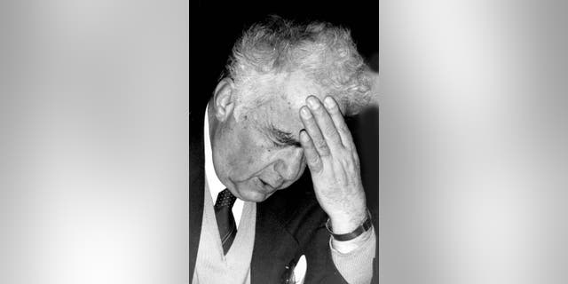 In this September, 1983 photo, Prominent Lebanese poet Saeed Akl gestures at his home, in Beirut, Lebanon. Lebanon’s state-run news agency says Saeed Akl, Lebanon’s leading poet whose fame once spread throughout the Arab world, has died. He was 102. The ultra-nationalist Akl wrote his poems in classical Arabic as well as Lebanese dialect which he used to refer to as “the Lebanese language.” (AP Photo/Stavro Jabra)