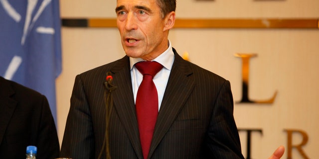 October 31: NATO Secretary-General Anders Fogh Rasmussen speaks to reporters in Tripoli, Libya. NATO's top official is praising the Libyans for their "courage, determination and sacrifice" to oust dictator Moammar Gadhafi, and says they have transformed Libya and "helped change the region."