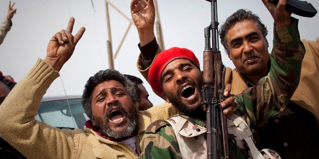 March 27, 2011: Libyan rebels jubilate on a checkpoint in Al-Egila, east of Ras Lanuf, eastern Libya.