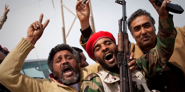 March 27, 2011: Libyan rebels jubilate on a checkpoint in Al-Egila, east of Ras Lanuf, eastern Libya.