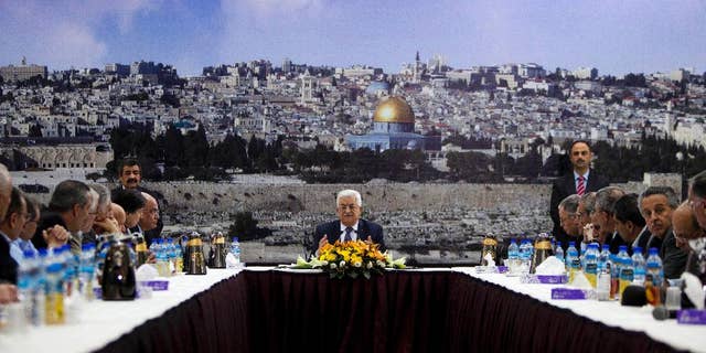 FILE - In this April 1, 2014 file photo Palestinian President Mahmoud Abbas talks during a leadership meeting in Ramallah. The examples from recent weeks signal that disagreeing with Abbas and his inner circle comes at a price for Palestinians. Critics say that after a decade in power, Abbas has created an increasingly authoritarian system with little room for dissent. (AP Photo/Majdi Mohammed, File)