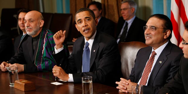 In this Wednesday, May 6, 2009 file photo, U.S. President Barack Obama, center, flanked by Afghan President Hamid Karzai, left, and Pakistani President Asif Ali Zardari gestures in the Cabinet Room of the White House in Washington. The United States has been pushing its powerhouse ally Saudi Arabia to help stabilize Pakistan and Afghanistan, but it has struggled to overcome the kingdom's deep mistrust of Pakistan's president and doubts over U.S. strategy for reining in militants, leaked U.S. diplomatic memos show.