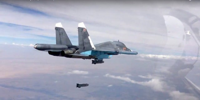 Oct. 9, 2015: A bomb is released from Russian Su-34 strike fighter in Syria.
