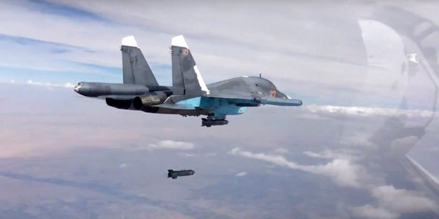 Oct. 9, 2015: A bomb is released from Russian Su-34 strike fighter in Syria.