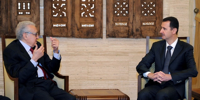 Dec. 24, 2012 - Syrian President Bashar al-Assad, right, meets with UN Arab League deputy to Syria, Lakhdar Brahimi in Damascus, Syria.