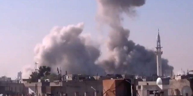 Dec. 27, 2012 - In this image taken from video obtained from the Shaam News Network, smoke rises from buildings from heavy shelling in Homs, Syria.