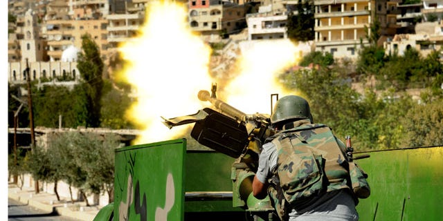 FILE -- In this Saturday, Sept. 7, 2013 file photo released by the Syrian official news agency SANA, a Syrian military solider fires a heavy machine gun during clashes with rebels in Maaloula village, northeast of the capital Damascus (AP Photo)