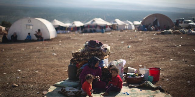 Nov. 7, 2012 - Syrian family who fled from the violence in their village, at a displaced camp, in the Syrian village of Atma.