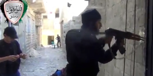 Friday, May 3, 2013 - Image taken from video obtained from the Ugarit News shows Syrian rebels clashing with government forces in Damascus, Syria.