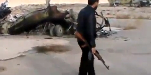 Nov. 25, 2012 - Image taken from video obtained from Ugarit News of Syrian rebels capturing a helicopter air base near the capital Damascus after fierce fighting in Syria.