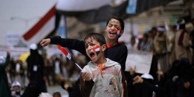 March 16: Yemeni children shout slogans along with anti-government protesters during a demonstration demanding the resignation of Yemeni President Ali Abdullah Saleh, in Sanaa, Yemen. Witnesses said government supporters wielding sticks, knives and guns attacked opposition protesters camped out at a main square in a southern Yemeni port, injuring hundreds, according to the Associated Press.