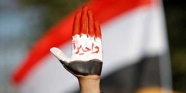 Dec. 20, 2012 - Female protestor displays her hand painted with Yemen's flag  &amp; Arabic reading "finally!" during a rally supporting president Abed Rabbu Mansour Hadi, in Sanaa, Yemen.