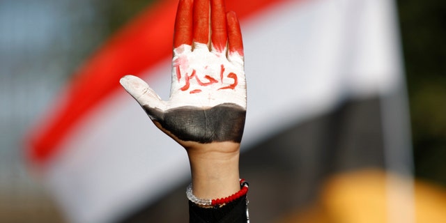 Dec. 20, 2012 - Female protestor displays her hand painted with Yemen's flag & Arabic reading "finally!" during a rally supporting president Abed Rabbu Mansour Hadi, in Sanaa, Yemen.