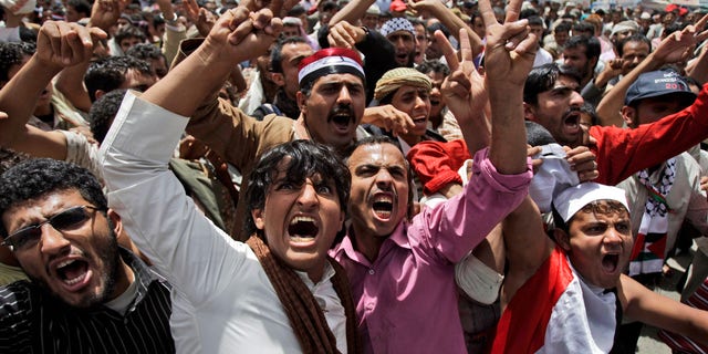 Anti-government protestors, shout slogans during a demonstration demanding the resignation of Yemeni President Ali Abdullah Saleh, in Sanaa, Yemen, Saturday, May 7, 2011.