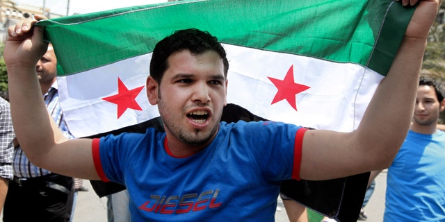 May 18, 2012: An anti-Syrian regime protester, chants slogans during a demonstration to show solidarity with the Syrian revolution in Beirut, Lebanon.