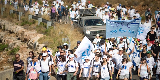 June 27: Family members of Israeli captured soldier Sgt. Gilad Schalit and their supporters march near Schalit's home in Mitzpe Hila, northern Israel. (AP)