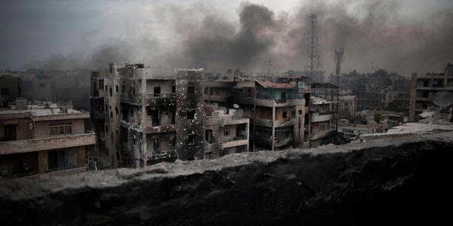Oct. 2, 2012: Smoke rises over Saif Al Dawla district, in Aleppo, Syria.