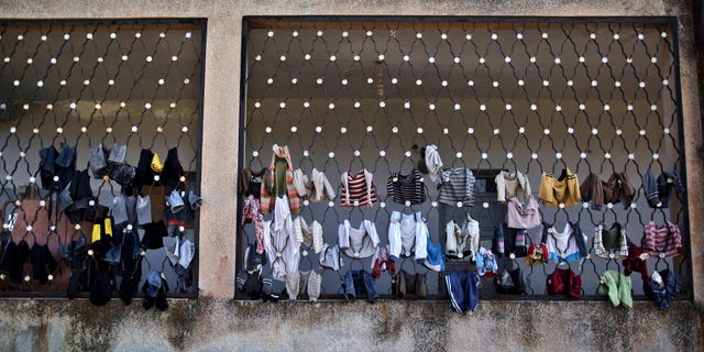 Dec. 14, 2012: Laundry belongs to Syrian children who fled their homes with their families due government airstrikes, are hung on a school where they are taking refuge, in Maaret Misreen, near Idlib, Syria.