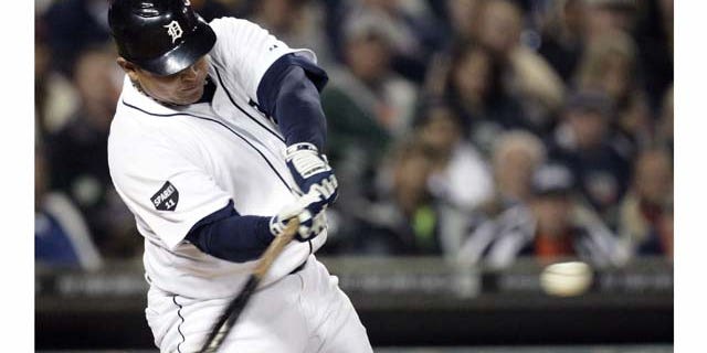 Detroit Tigers' Miguel Cabrera hits a solo home run against the Cleveland Indians in the sixth inning of a baseball game Tuesday, Sept. 27, 2011 in Detroit. (AP Photo/Duane Burleson)