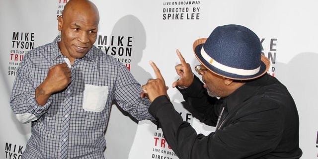 Aug. 2: Mike Tyson, left, and Spike Lee pose backstage after the curtain call on the opening night of 'Mike Tyson: Undisputed Truth' at the Longacre Theatre in New York.