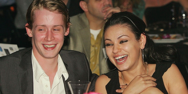 Mila Kunis and Macaulay Culkin in 2005.
