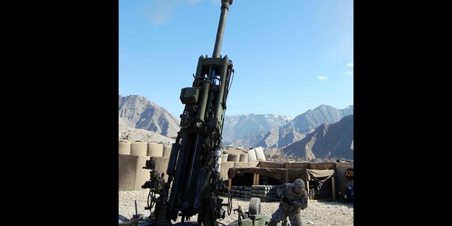 In this Feb. 25, 2008 photo, Pvt. Corey Rodriguez pulls the lanyard on the M-777A2 during the first firing of the Army's new GPS-guided Excalibur artillery round. A software glitch that temporarily left as many as 10,000 military GPS receivers unable to lock on to satellite locator signals showed how dependent the U.S. military has become on the Global Positioning System.