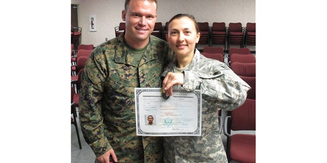 March 16: Army Spc. Rima Rusnac poses with her fiance, Staff Sgt. Ian Voss, after taking the oath to become a U.S. citizen, at Fort Jackson, S.C.