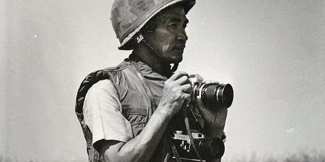 FILE 1972: Photo provided by Quynh Thai shows former Vietnamese photographer Le Minh Thai during the battle of An Loc in Vietnam during the war in Vietnam.