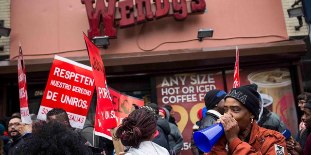 NEW YORK, NY - DECEMBER 05:  Protesters rally outside of a Wendy's in support of raising fast food wages from $7.25 per hour to $15.00 per hour on December 5, 2013 in the Brooklyn borough of New York City. A growing number of fast food workers in the United States have been staging protests outside restaurants, calling for a raise in wages, claiming it is impossible to live resonably while earning minimum wage.  (Photo by Andrew Burton/Getty Images)