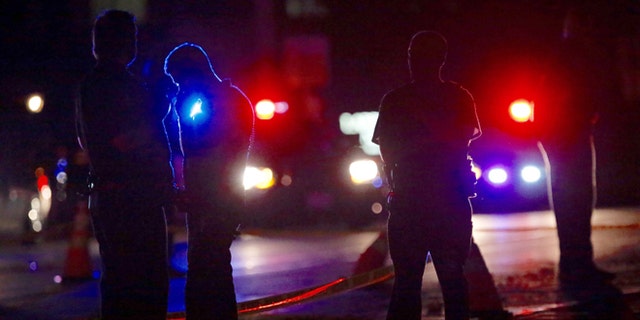 Investigators at the scene of a police-involved shooting on Wednesday, July 6, 2016, in Falcon Heights, Minn.