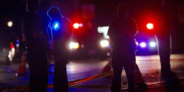 Investigators at the scene of a police-involved shooting on Wednesday, July 6, 2016, in Falcon Heights, Minn.