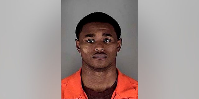 This booking photo released by the Hennepin County Jail in Minneapolis, shows Minnesota college basketball player Daquein McNeil, who was arrested Monday, Nov. 24, 2014, on a charge of domestic assault. He was suspended from all team activities, athletic director Norwood Teague said. (AP Photo/Hennepin County Jail, via The Star Tribune)