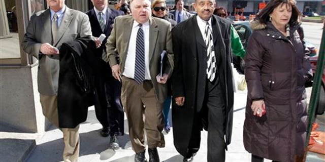 March 28: Minority Leader Pat Bauer walks with fellow Democrats while returning to the Statehouse in Indianapolis.