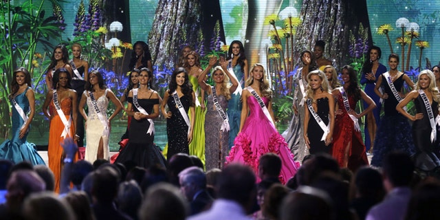 Contestants wave onstage at the conclusion of the preliminary round of the 2015 Miss USA Pageant in Baton Rouge, La., Wednesday, July 8, 2015. (AP Photo/Gerald Herbert)